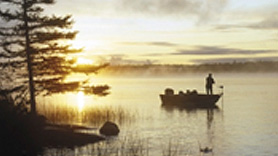 Fisherman on coastal waters early in the morning